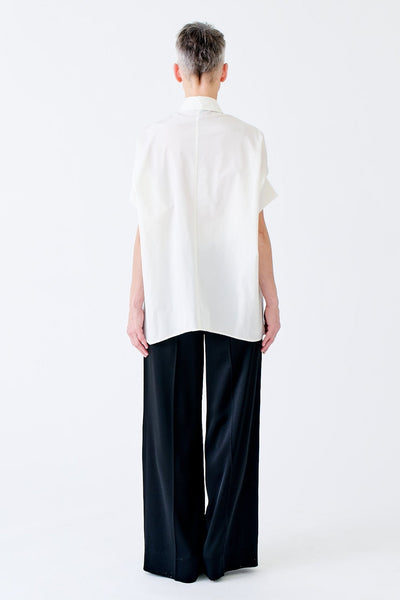 wingate collection tello white top on female model with silver slippers back