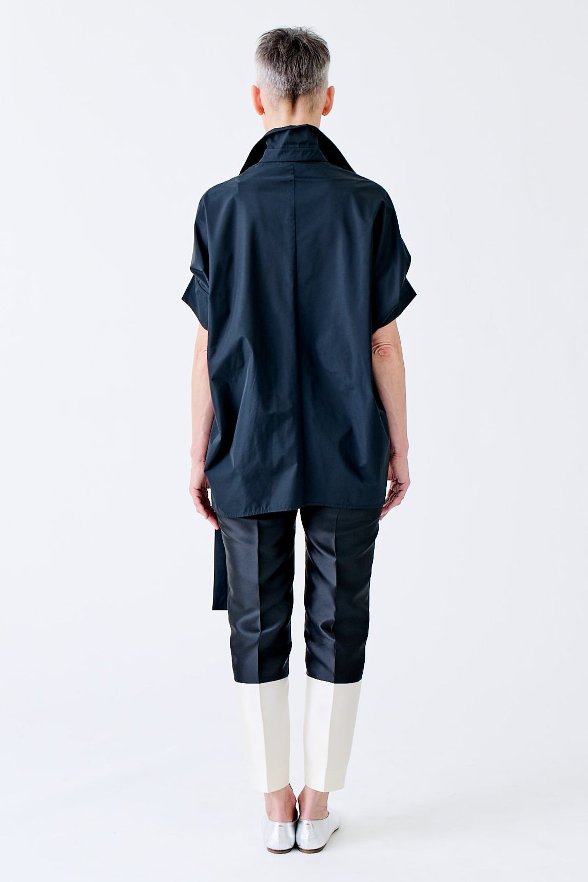 wingate collection tello black top on female model with silver slippers back