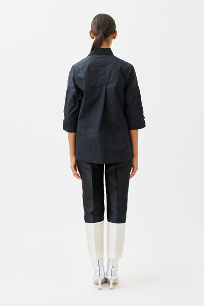 wingate collection tayne black top on female model with silver slippers back