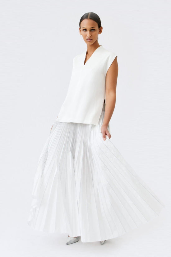 wingate collection taru white top on female model with silver slippers dynamic