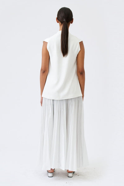 wingate collection taru white top on female model with silver slippers back