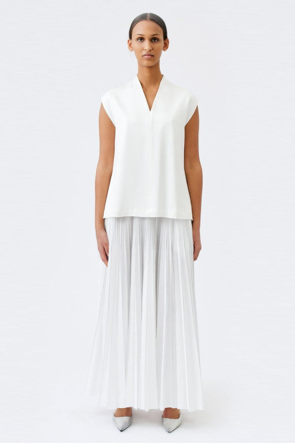 wingate collection taru white top on female model with silver slippers front