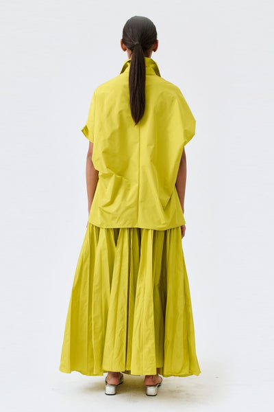 wingate collection tello yellow top on female model with silver slippers back