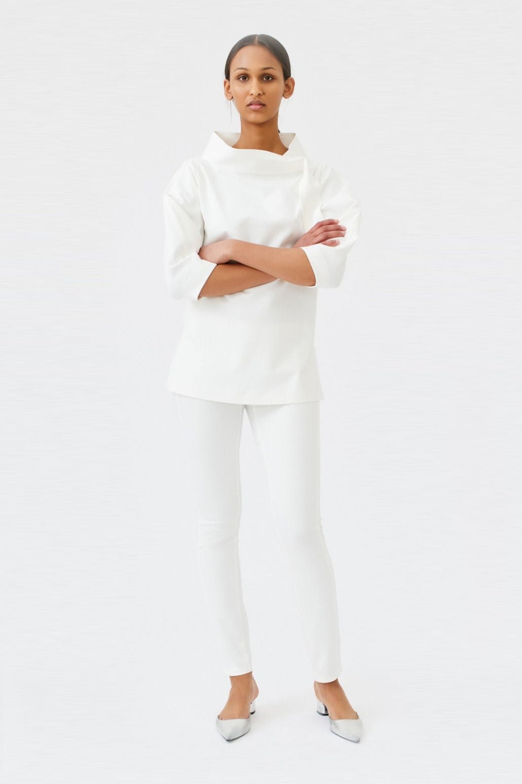 wingate collection teno white top on female model with silver slippers dynamic