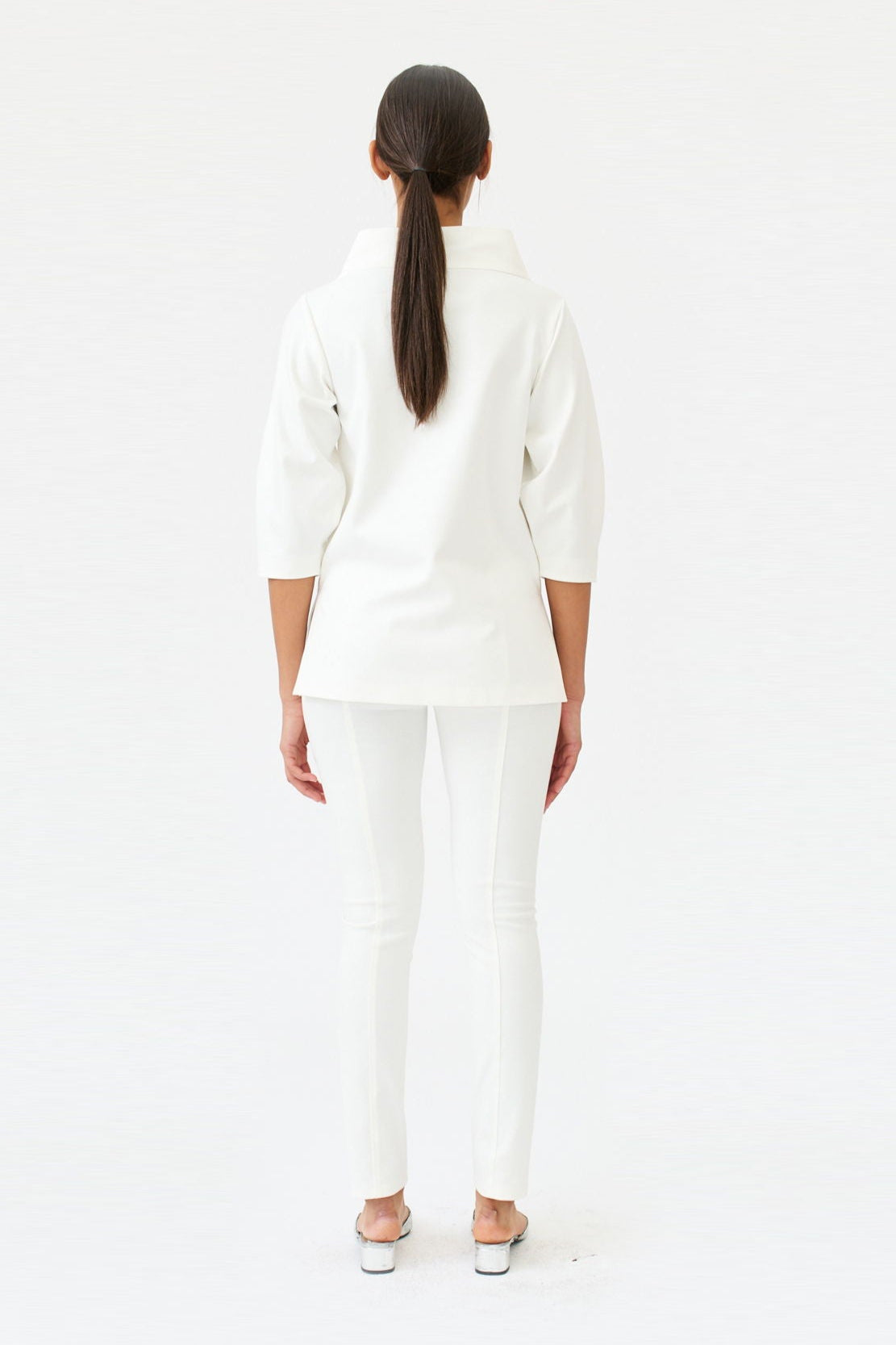 wingate collection teno white top on female model with silver slippers back