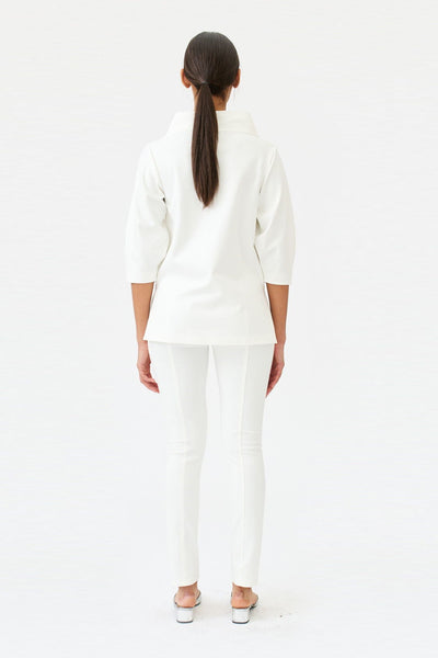 wingate collection teno white top on female model with silver slippers back