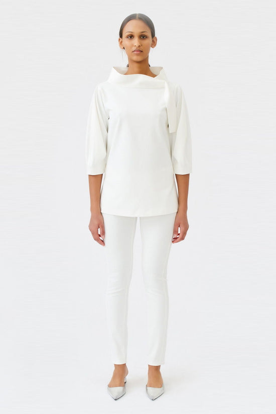 wingate collection teno white top on female model with silver slippers front