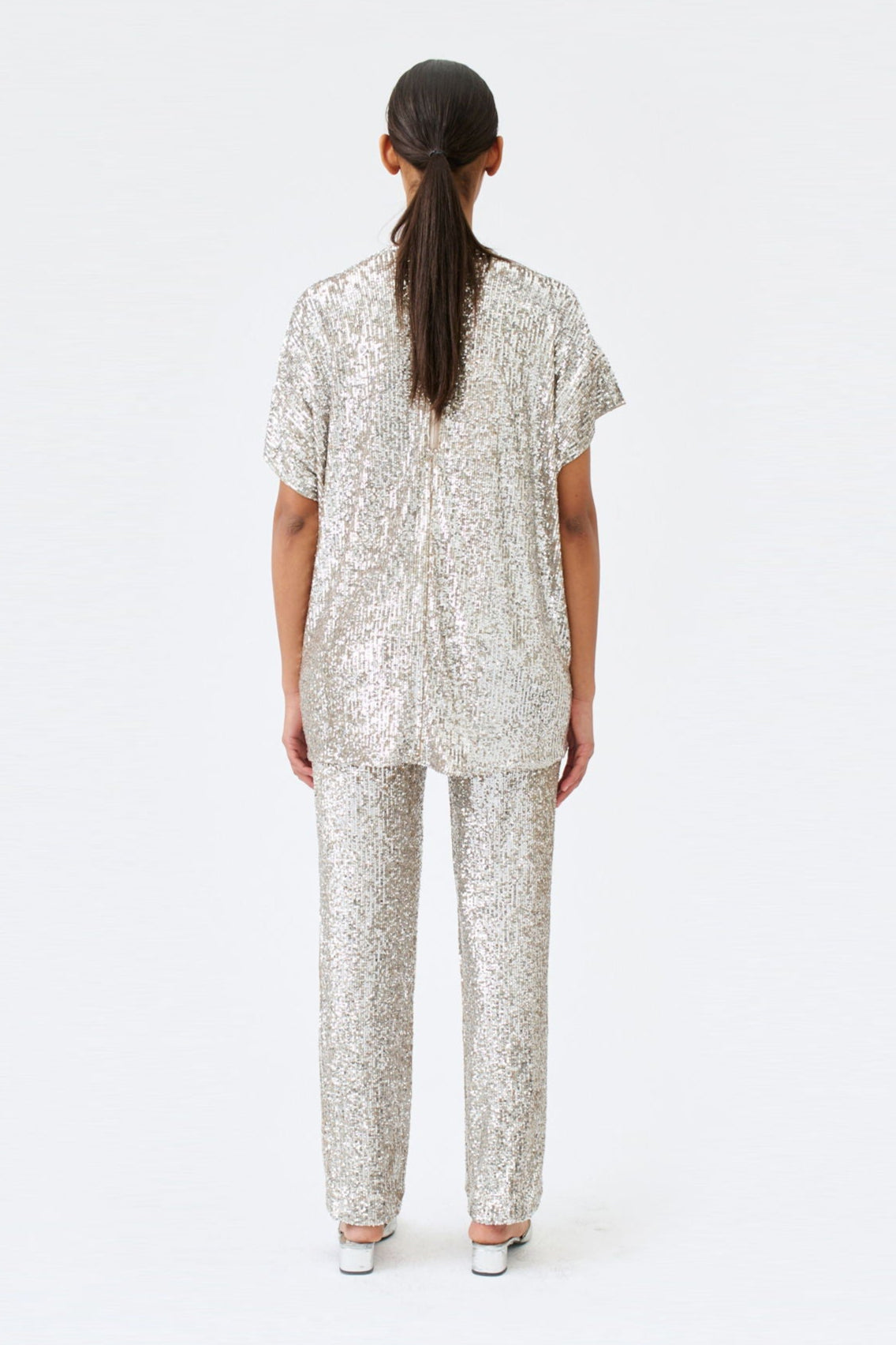 wingate collection tia silver top on female model with silver slippers back