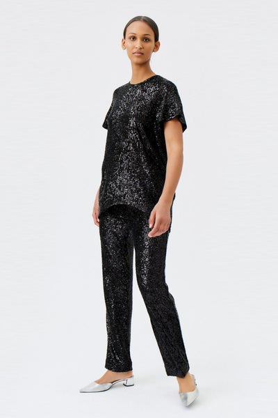 wingate collection tia black top on female model with silver slippers dynamic