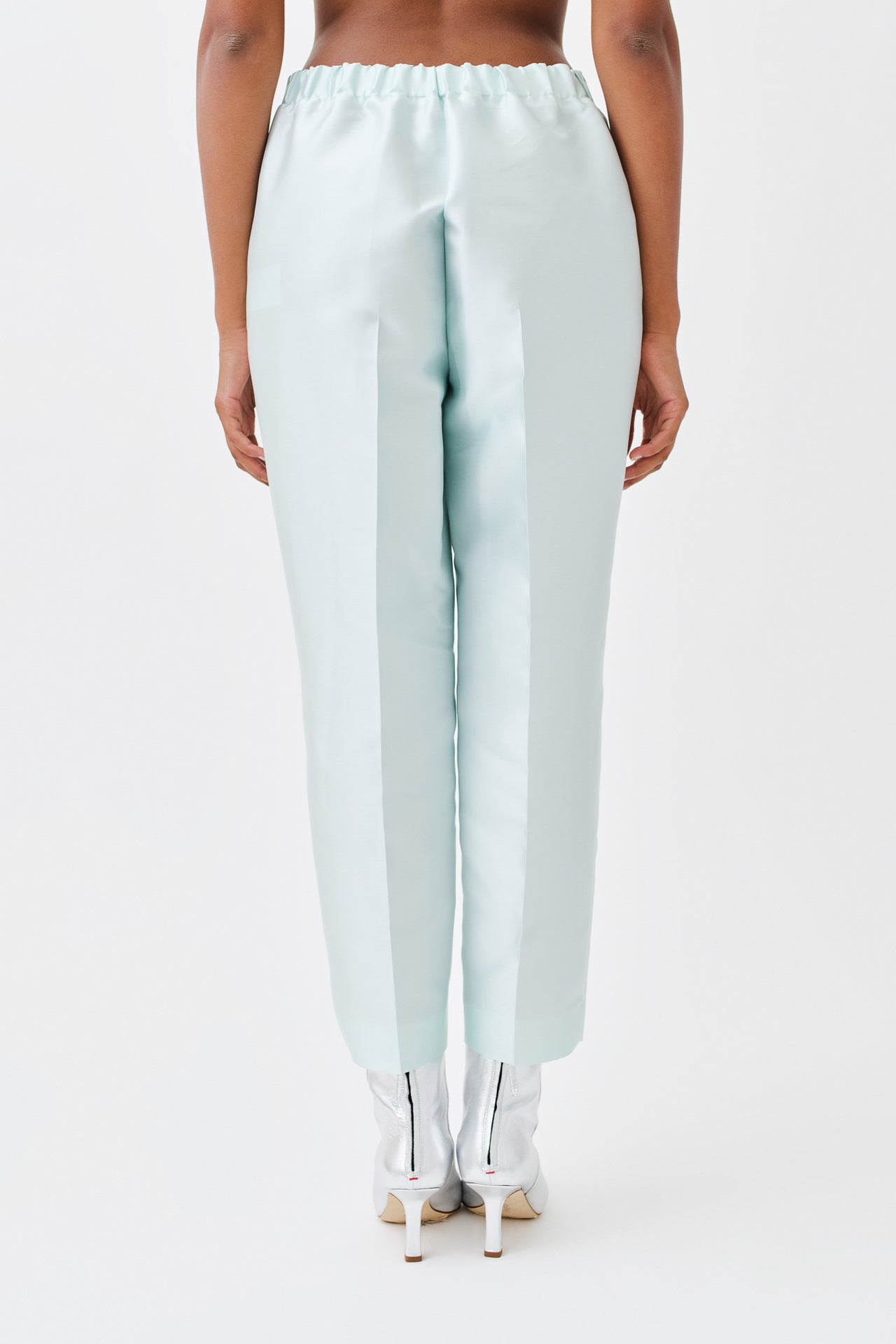 wingate collection peyti pink pants on female model with silver boots back