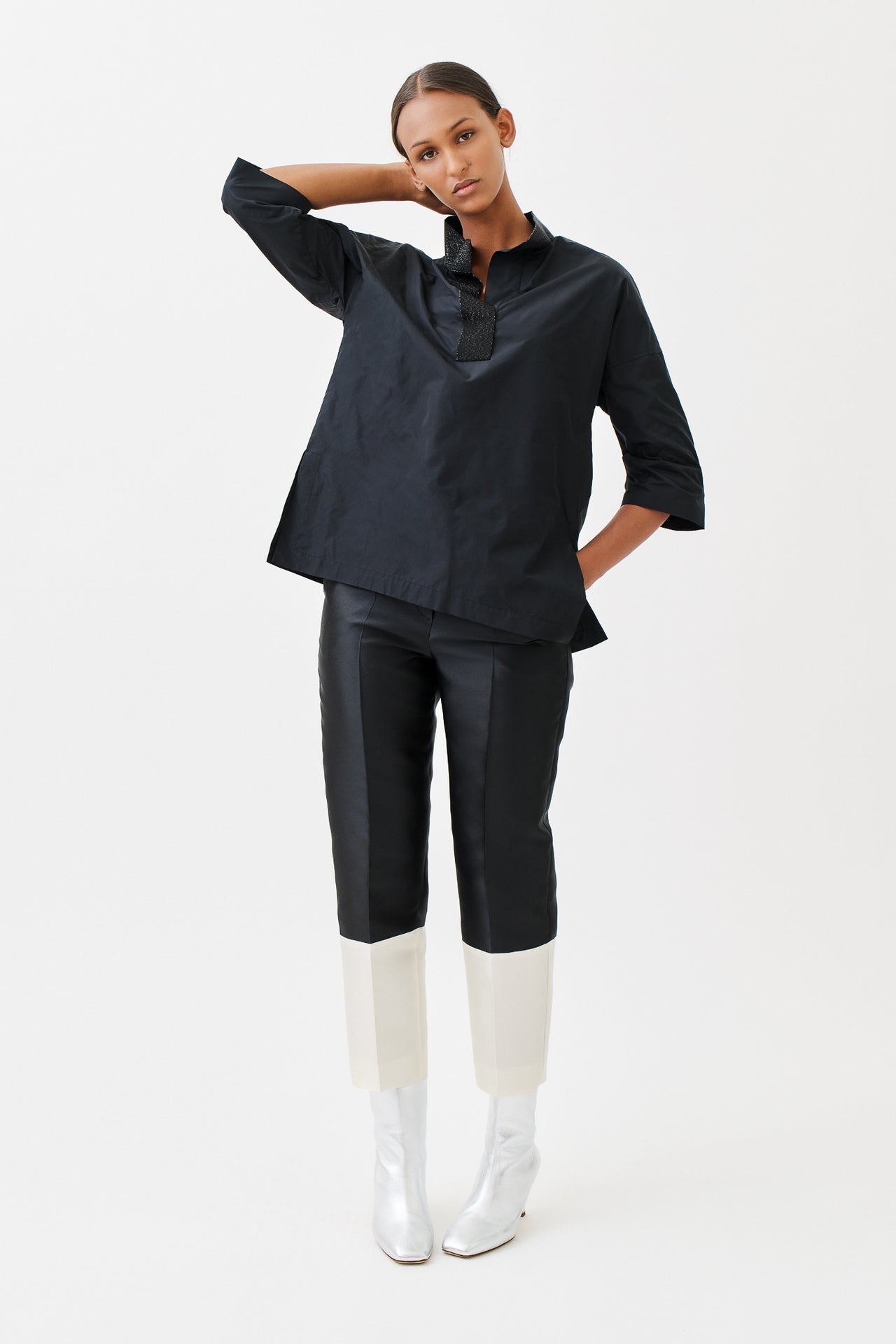 wingate collection tayne black top on female model with silver slippers dynamic