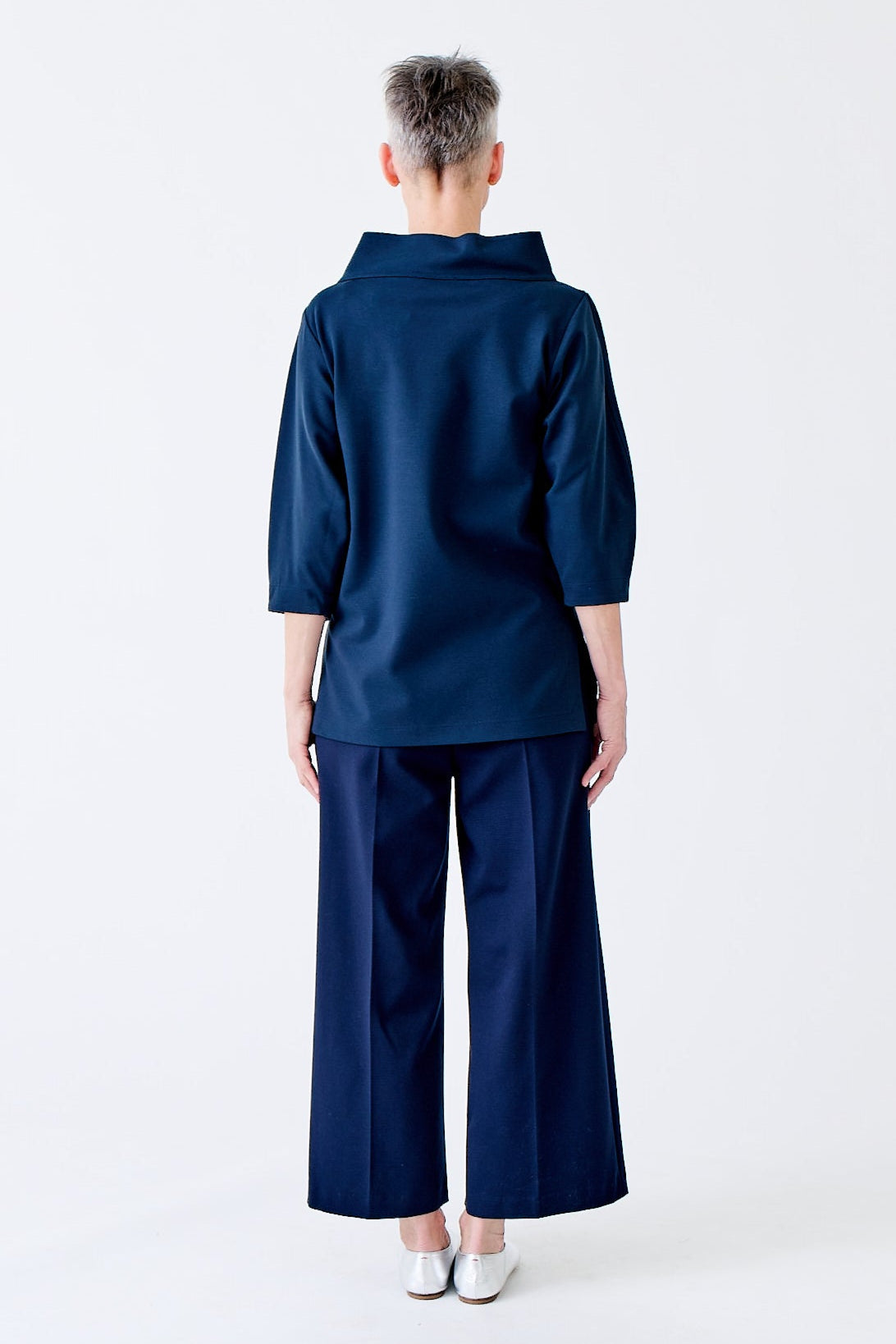 wingate collection teno blue top on female model with silver boots back