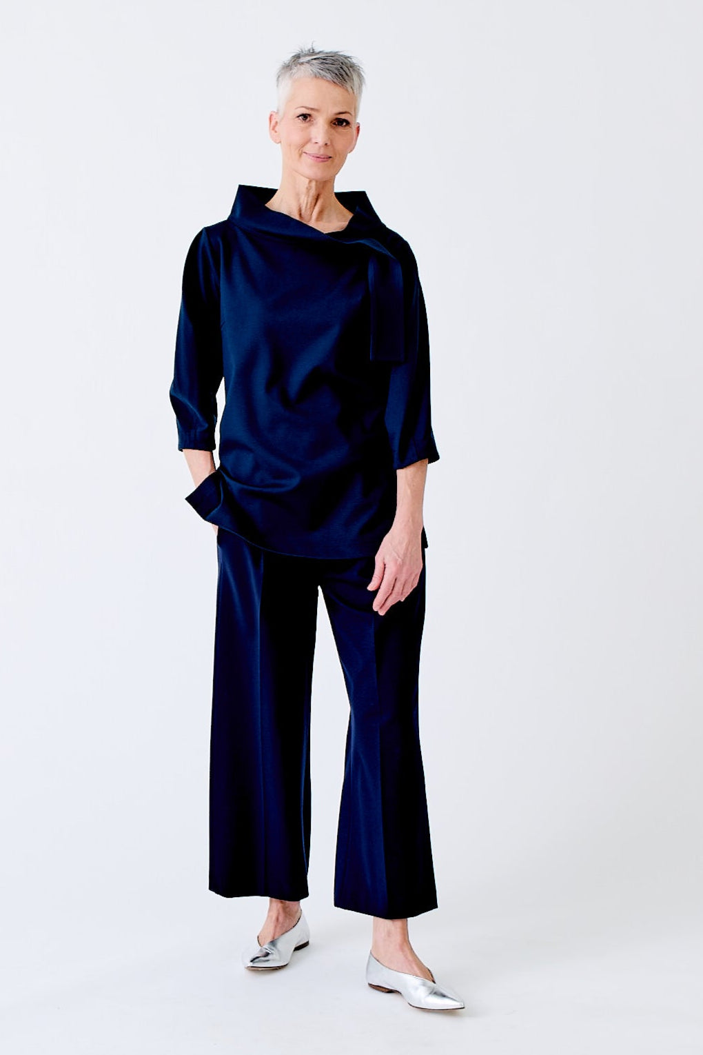 wingate collection teno blue top on female model with silver boots dynamic