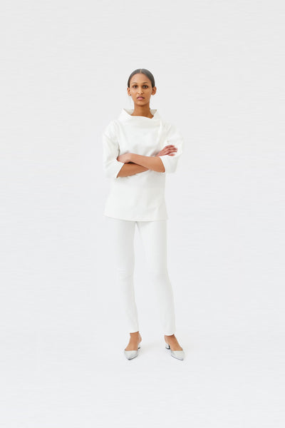 wingate collection teno white top on female model with silver slippers dynamic
