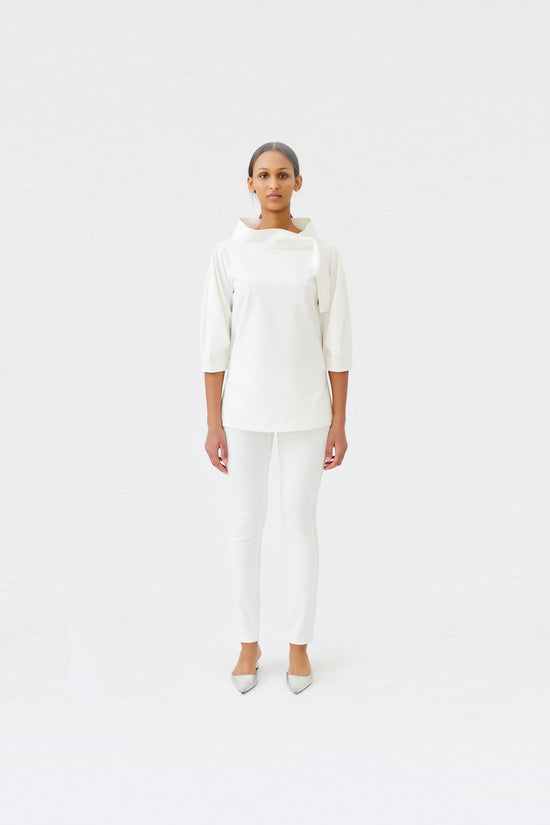 wingate collection teno white top on female model with silver slippers front