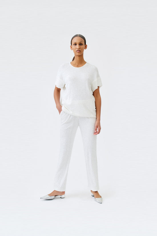 wingate collection tia white top on female model with silver slippers dynamic