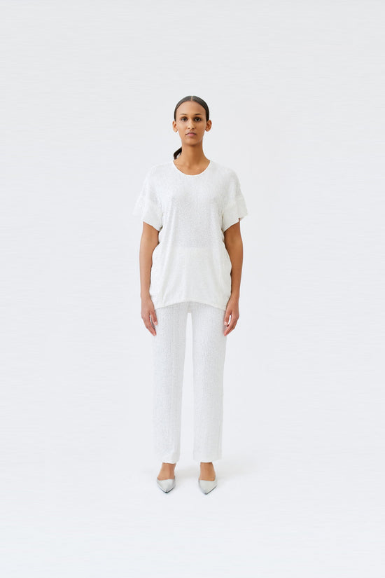 wingate collection tia white top on female model with silver slippers front