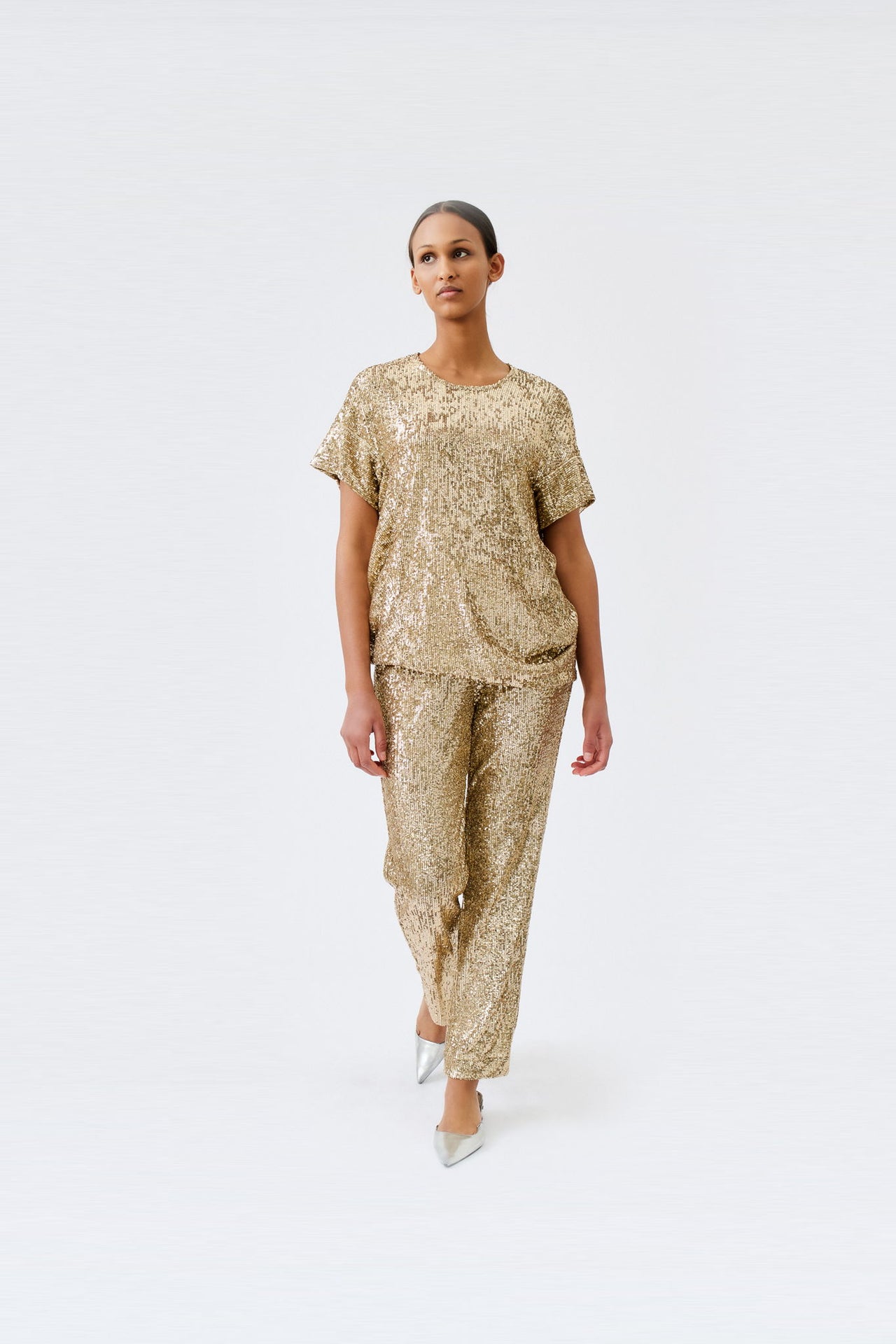 wingate collection tia gold top on female model with silver slippers dynamic