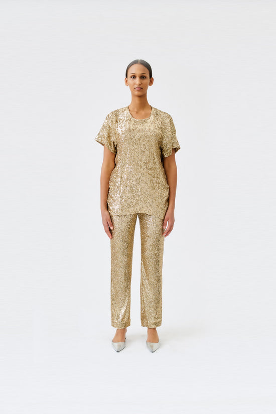wingate collection tia gold top on female model with silver slippers front