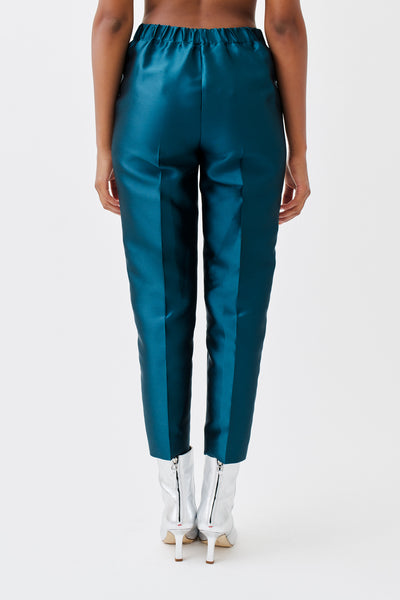 wingate collection peyti blue teal pants on female model with silver boots back