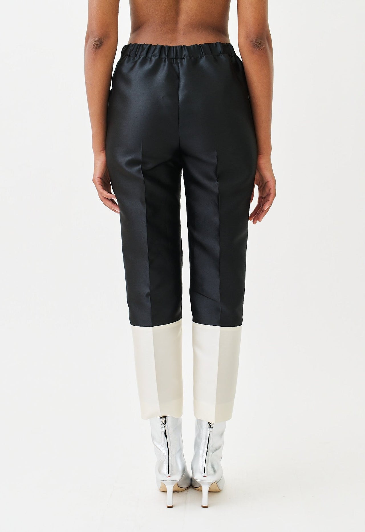 wingate collecton peyton black white pants on female model with silver boots back